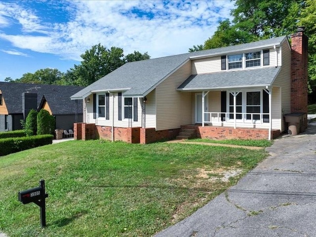 view of front of house featuring a porch and a front yard