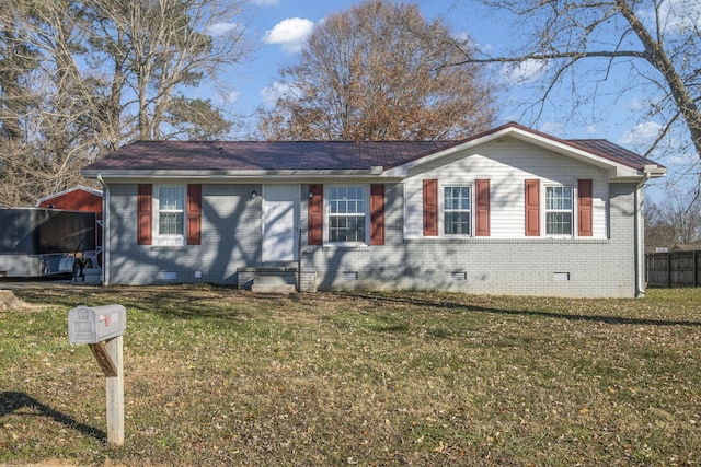 single story home with a front lawn