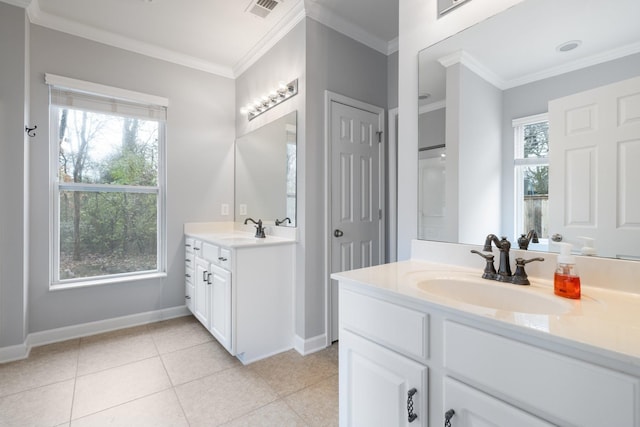 bathroom featuring tile patterned floors, vanity, a healthy amount of sunlight, and ornamental molding