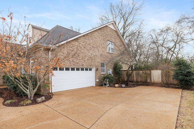 view of side of home with a garage