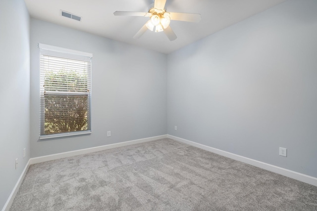 unfurnished room with light carpet and ceiling fan