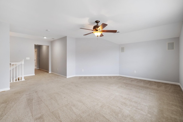 empty room featuring light colored carpet and ceiling fan