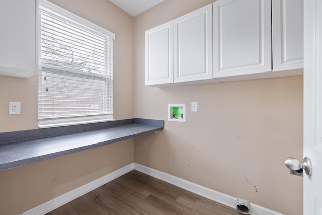 clothes washing area featuring hookup for a washing machine, dark hardwood / wood-style flooring, and cabinets