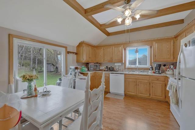 kitchen with light wood-type flooring, light brown cabinetry, and white appliances