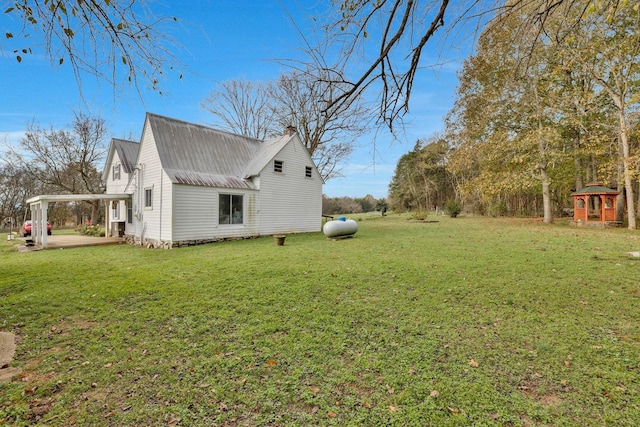 view of side of home featuring a yard