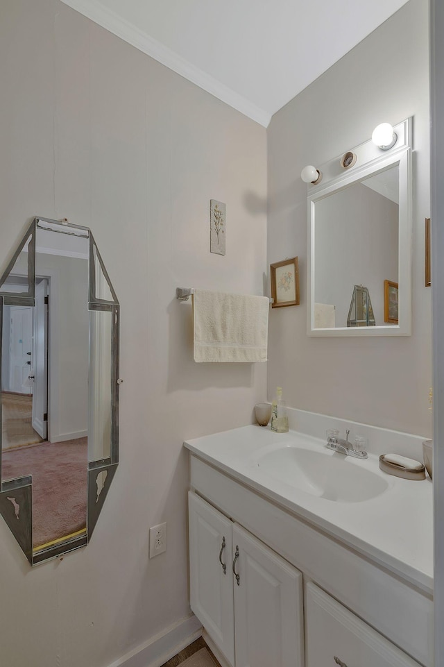 bathroom featuring vanity and ornamental molding