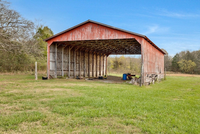 view of outbuilding featuring a lawn