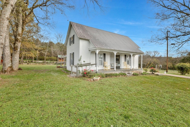 view of front facade with covered porch and a front lawn