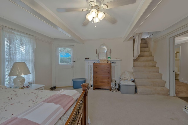 bedroom with beam ceiling, ceiling fan, light colored carpet, and ornamental molding