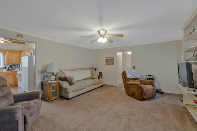 carpeted living room featuring ceiling fan and ornamental molding