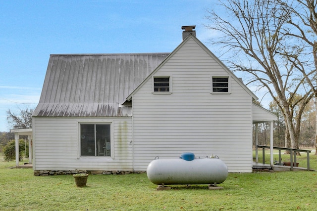 view of side of home featuring a lawn