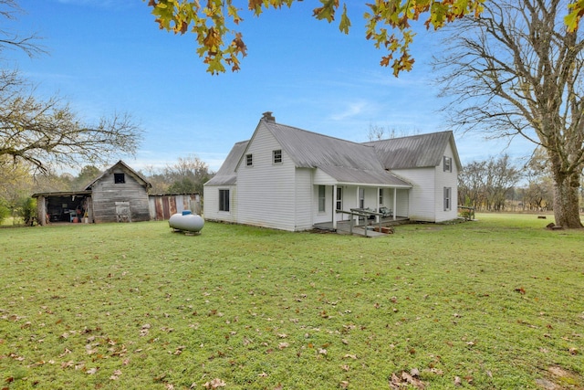 view of property exterior featuring a yard and an outdoor structure