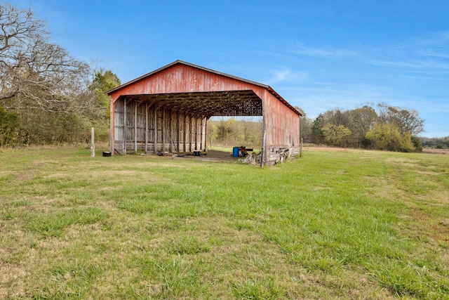 view of outbuilding with a lawn