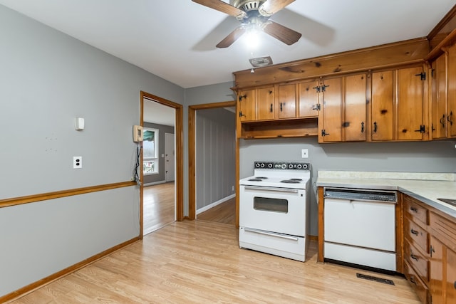 kitchen with light wood-type flooring, white appliances, and ceiling fan