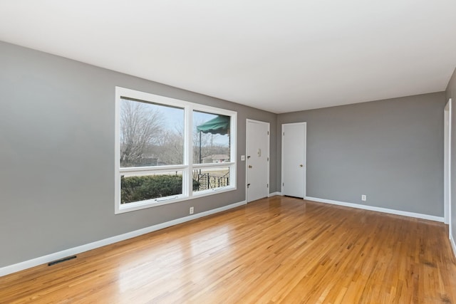 spare room featuring light hardwood / wood-style flooring