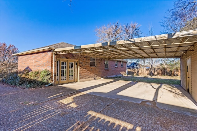 back of house with a carport