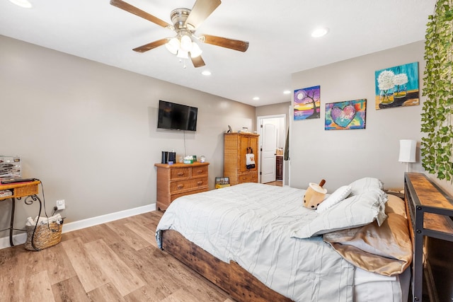 bedroom featuring ceiling fan and light hardwood / wood-style floors