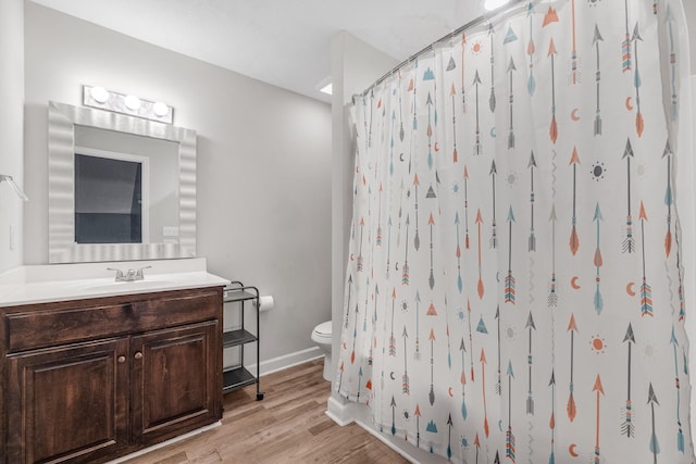 bathroom with vanity, a shower with shower curtain, wood-type flooring, and toilet