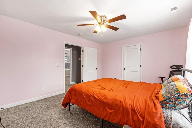 carpeted bedroom featuring ceiling fan