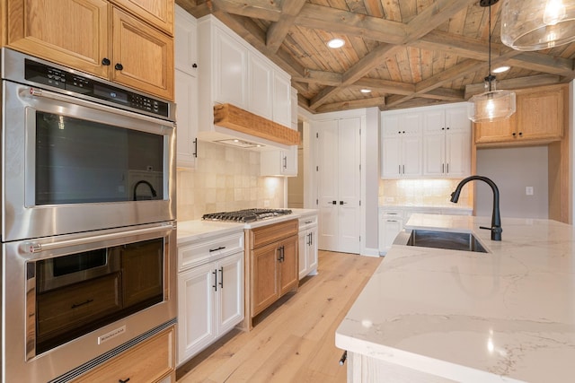 kitchen featuring white cabinetry, light hardwood / wood-style flooring, wooden ceiling, and appliances with stainless steel finishes