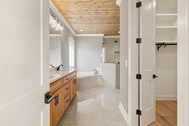 bathroom with tile patterned floors, wood ceiling, vanity, crown molding, and tiled bath