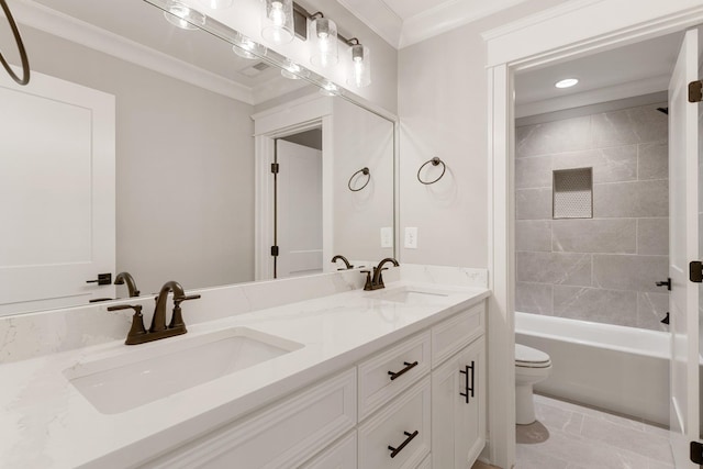 full bathroom with vanity, toilet, ornamental molding, and tiled shower / bath