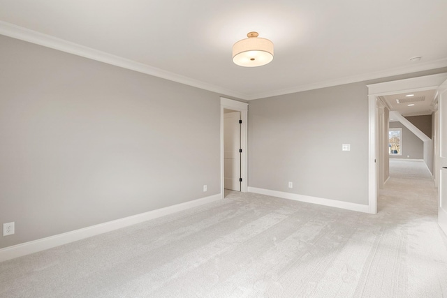 carpeted empty room featuring ornamental molding