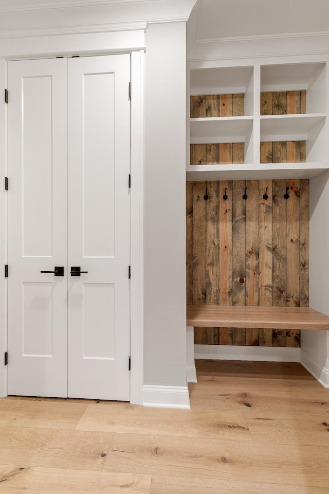 mudroom with light hardwood / wood-style floors