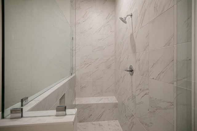 bathroom featuring tiled shower