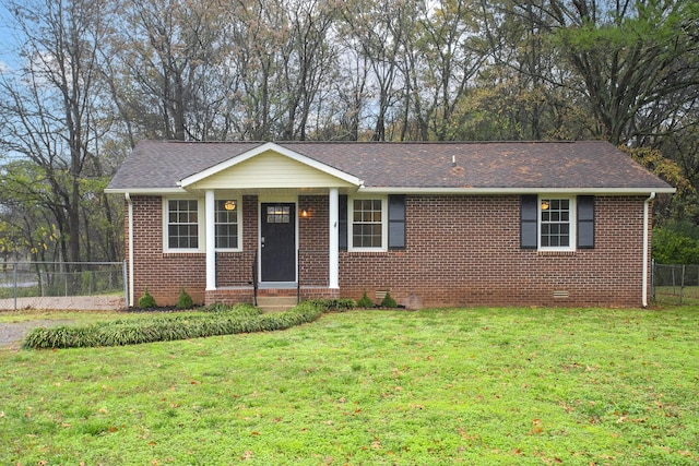 ranch-style home featuring a front yard