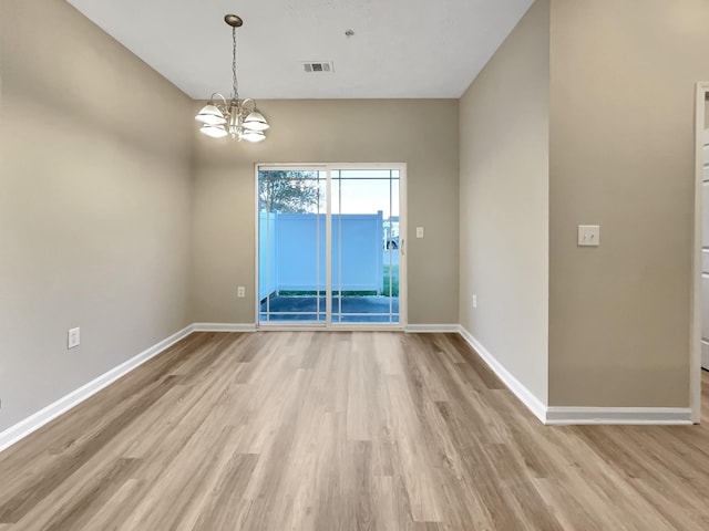2002 Arum Ct, Spring Hill, TN 37174 - empty room with light wood-style flooring and a chandelier