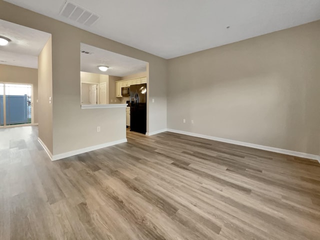 2002 Arum Ct, Spring Hill, TN 37174 - unfurnished living room featuring wood finished floors
