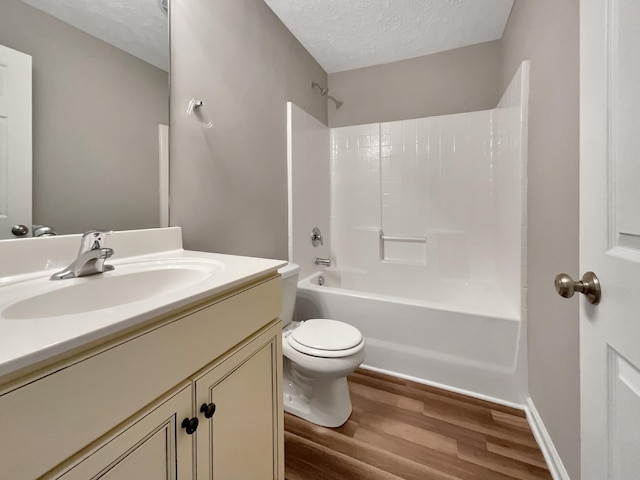 2002 Arum Ct, Spring Hill, TN 37174 - bathroom with a textured ceiling, wood finished floors, vanity, and shower / tub combination