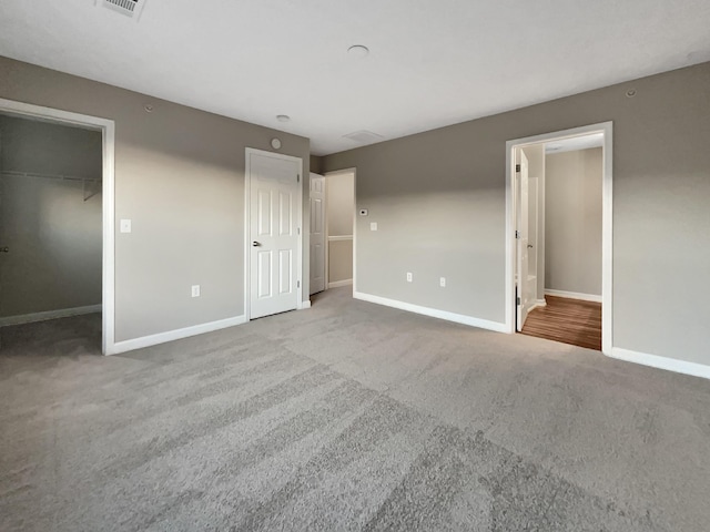 2002 Arum Ct, Spring Hill, TN 37174 - unfurnished bedroom with carpet floors and a spacious closet