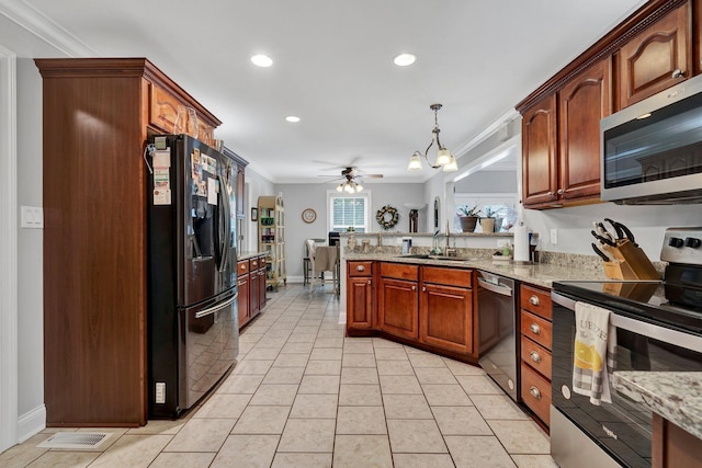 kitchen featuring appliances with stainless steel finishes, ceiling fan with notable chandelier, crown molding, sink, and decorative light fixtures