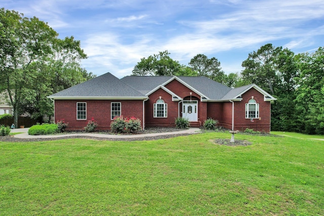 ranch-style house featuring a front lawn