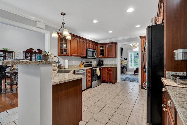 kitchen featuring kitchen peninsula, appliances with stainless steel finishes, crown molding, pendant lighting, and a notable chandelier