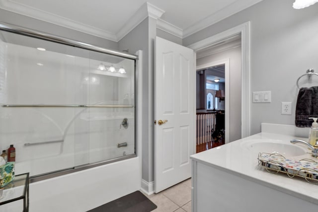 bathroom with tile patterned flooring, vanity, combined bath / shower with glass door, and ornamental molding