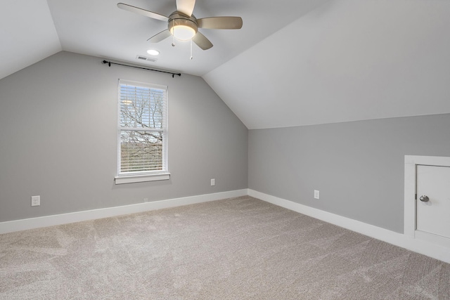 additional living space featuring carpet flooring, ceiling fan, and lofted ceiling