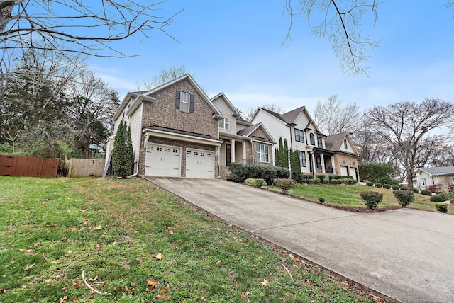 view of front of property featuring a garage and a front lawn