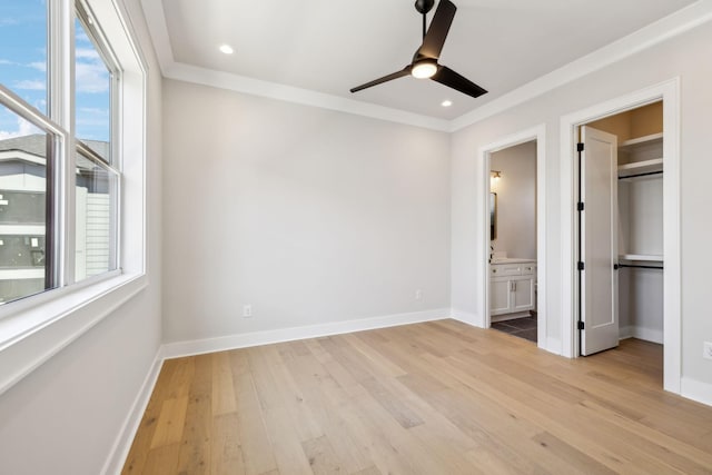 unfurnished bedroom featuring baseboards, wood finished floors, and recessed lighting