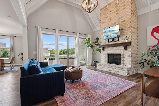 living room with beam ceiling, dark hardwood / wood-style flooring, a fireplace, and high vaulted ceiling