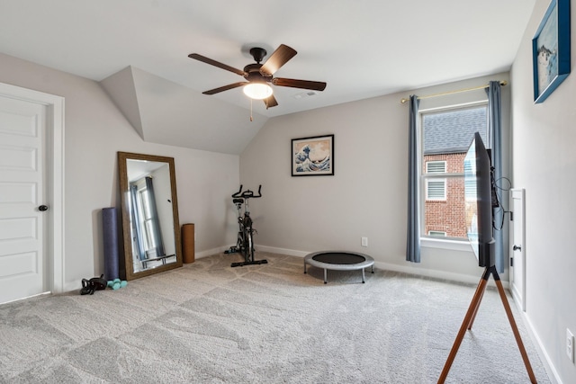 workout area featuring light colored carpet, ceiling fan, and lofted ceiling