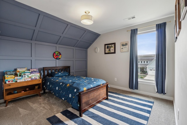 carpeted bedroom with multiple windows