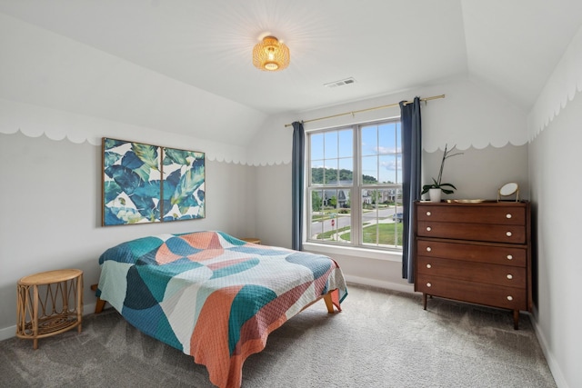 carpeted bedroom featuring vaulted ceiling