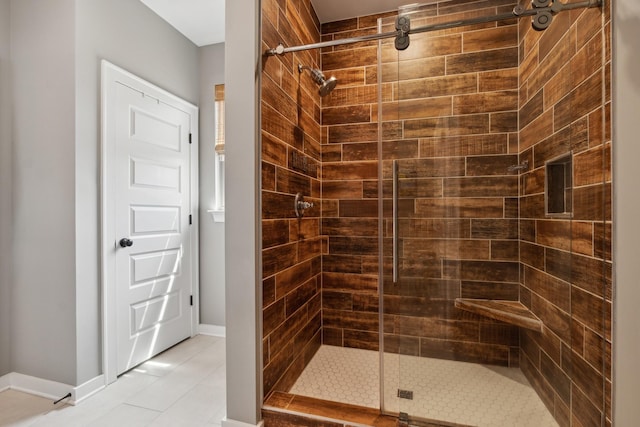 bathroom with tile patterned floors and an enclosed shower