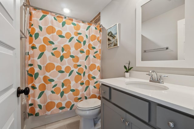 bathroom with toilet, a shower with curtain, vanity, and tile patterned floors