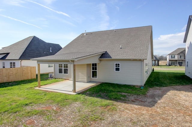 back of house with a yard, a patio, and central AC