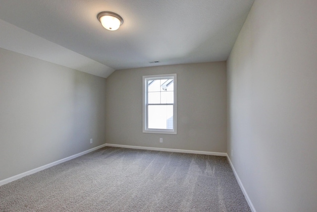 bonus room featuring carpet floors and vaulted ceiling