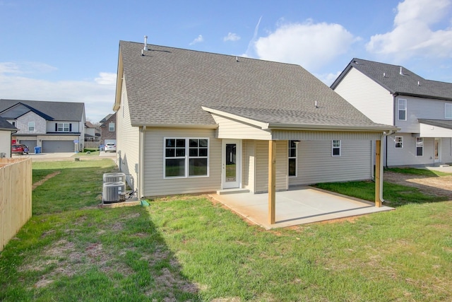 back of house featuring a yard, a patio, and cooling unit